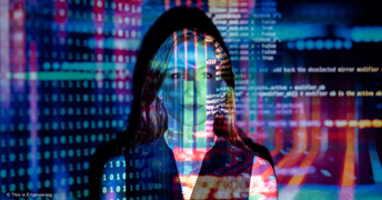 Female software engineer with projected code
